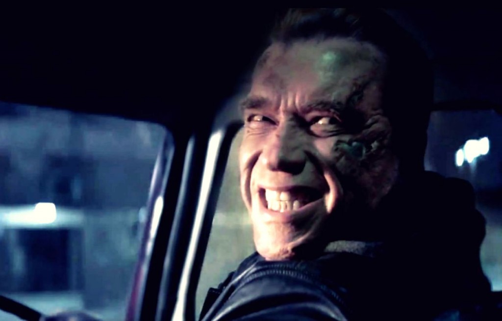 Arnold Schwarzenegger smiling while driving car