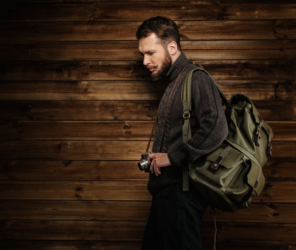 man showcasing travel backpacks for men