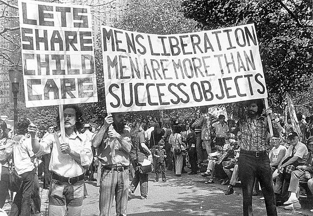 Image of men marching in 1972 men's liberation movement