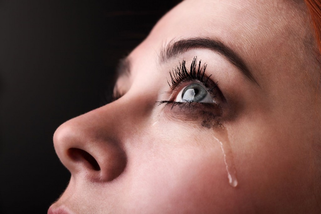 woman crying, tears rolling down her face
